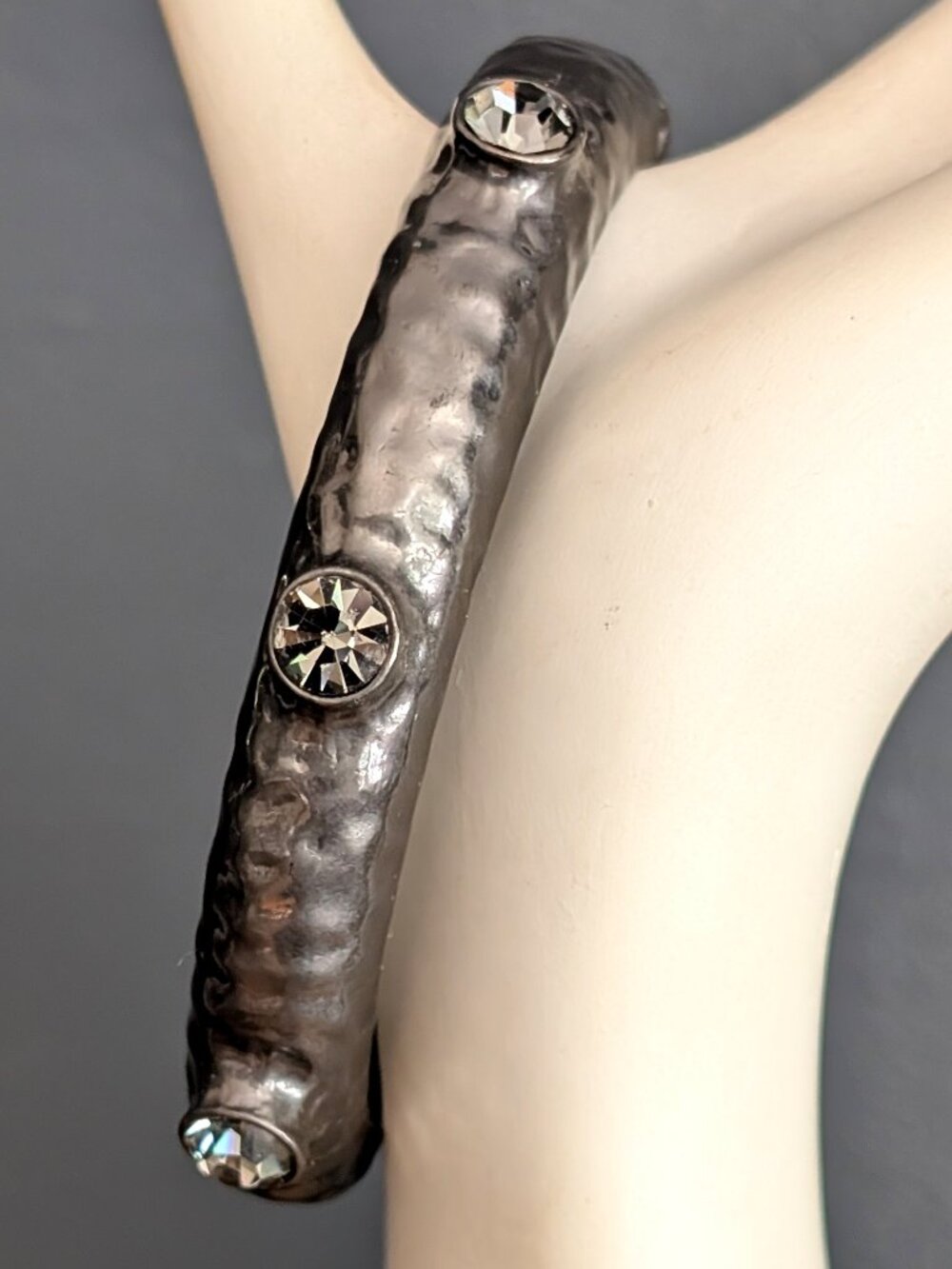 Gray hammered metal bracelet with gray glass beads